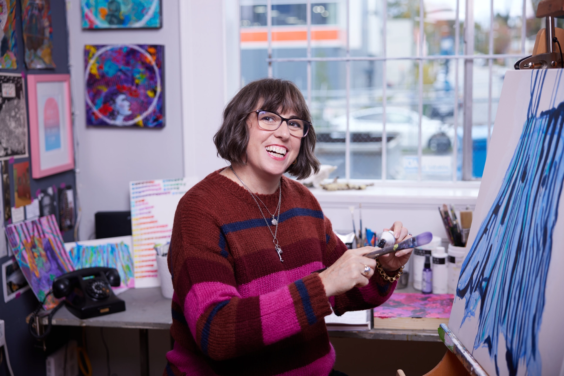 female painter in her colourful studio in East Vancouver